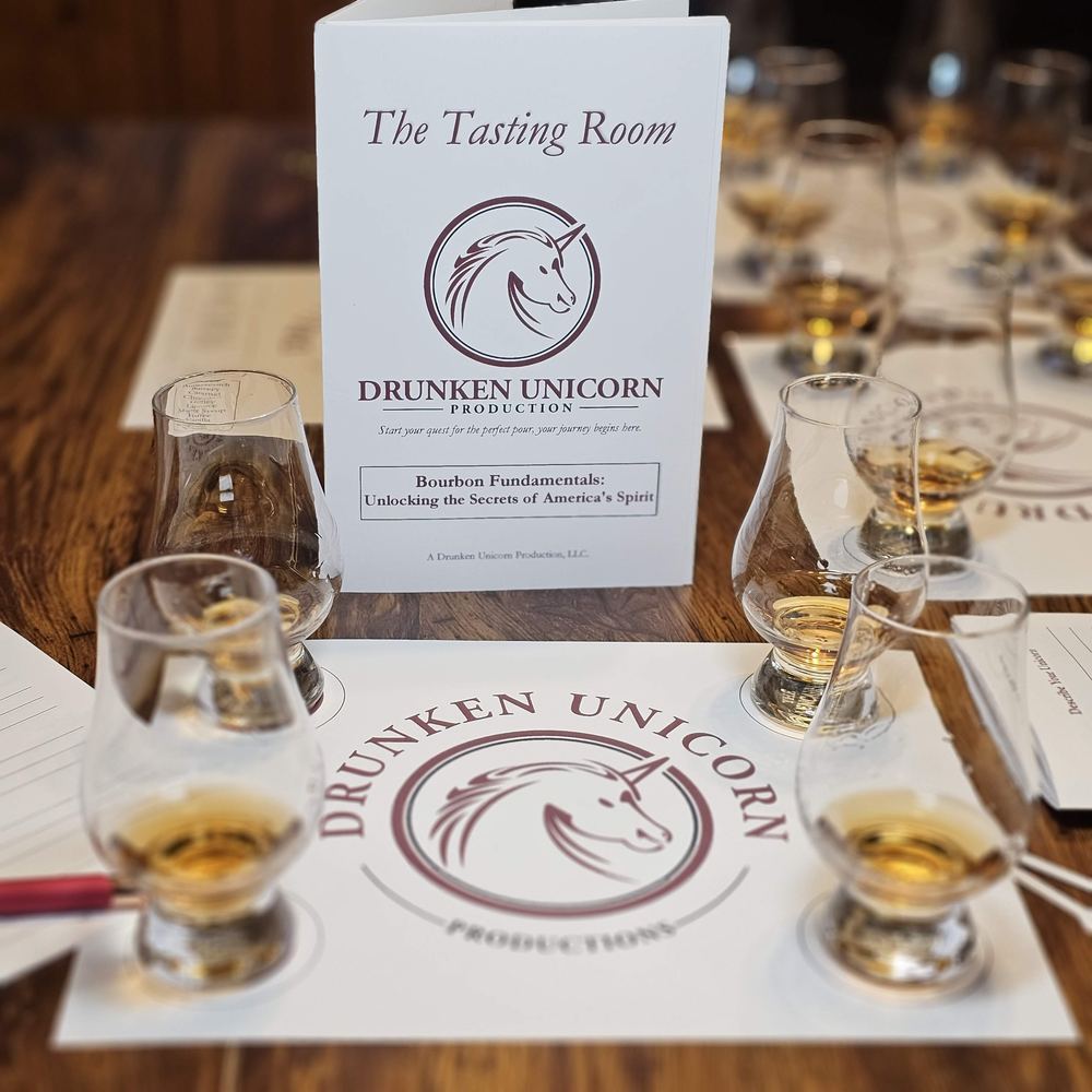 A Drunken Unicorn table set for the tasting: the glasses, the tasting mats and The Tasting Room booklet